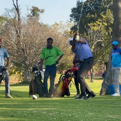 Golfers gathered on the tee